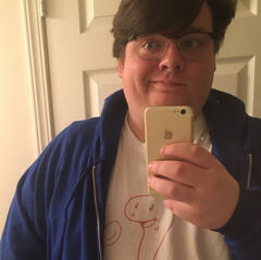 Andrew in his natural state; dressed as a wizard.